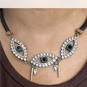 Chic Eye Motif Necklace with Gold and Black Details